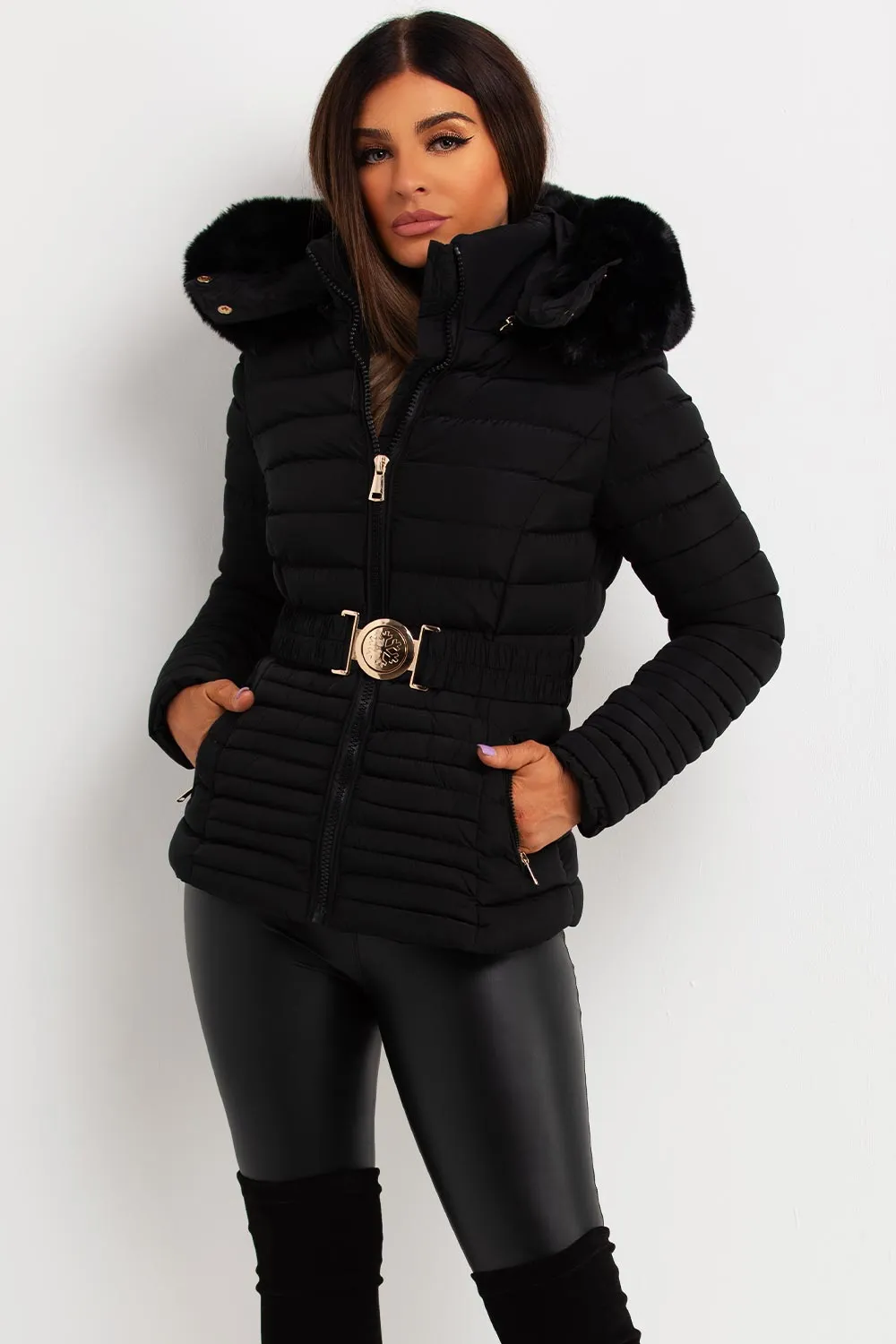 Black Puffer Jacket With Faux Fur Hood And Gold Belt