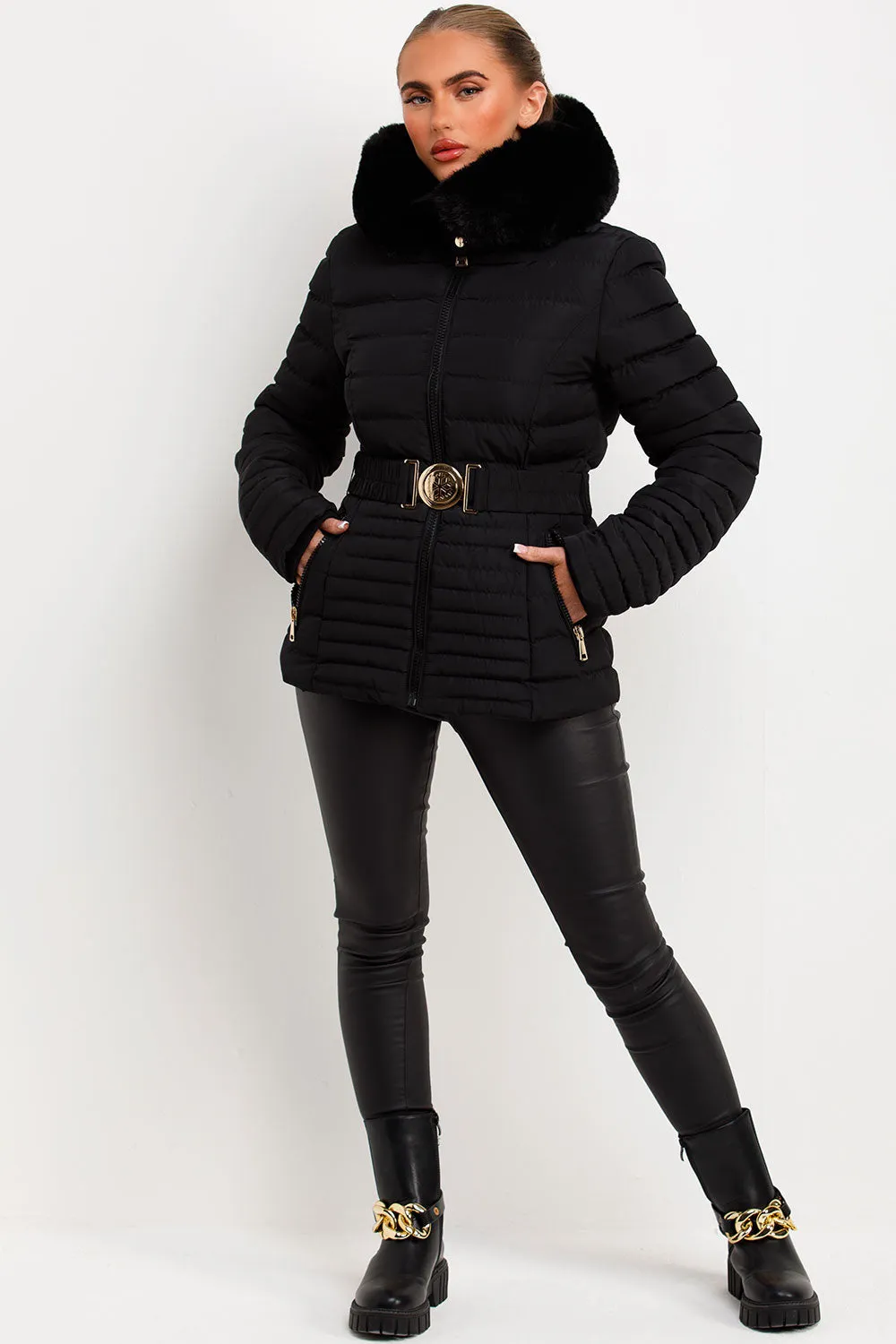 Black Puffer Jacket With Faux Fur Hood And Gold Belt